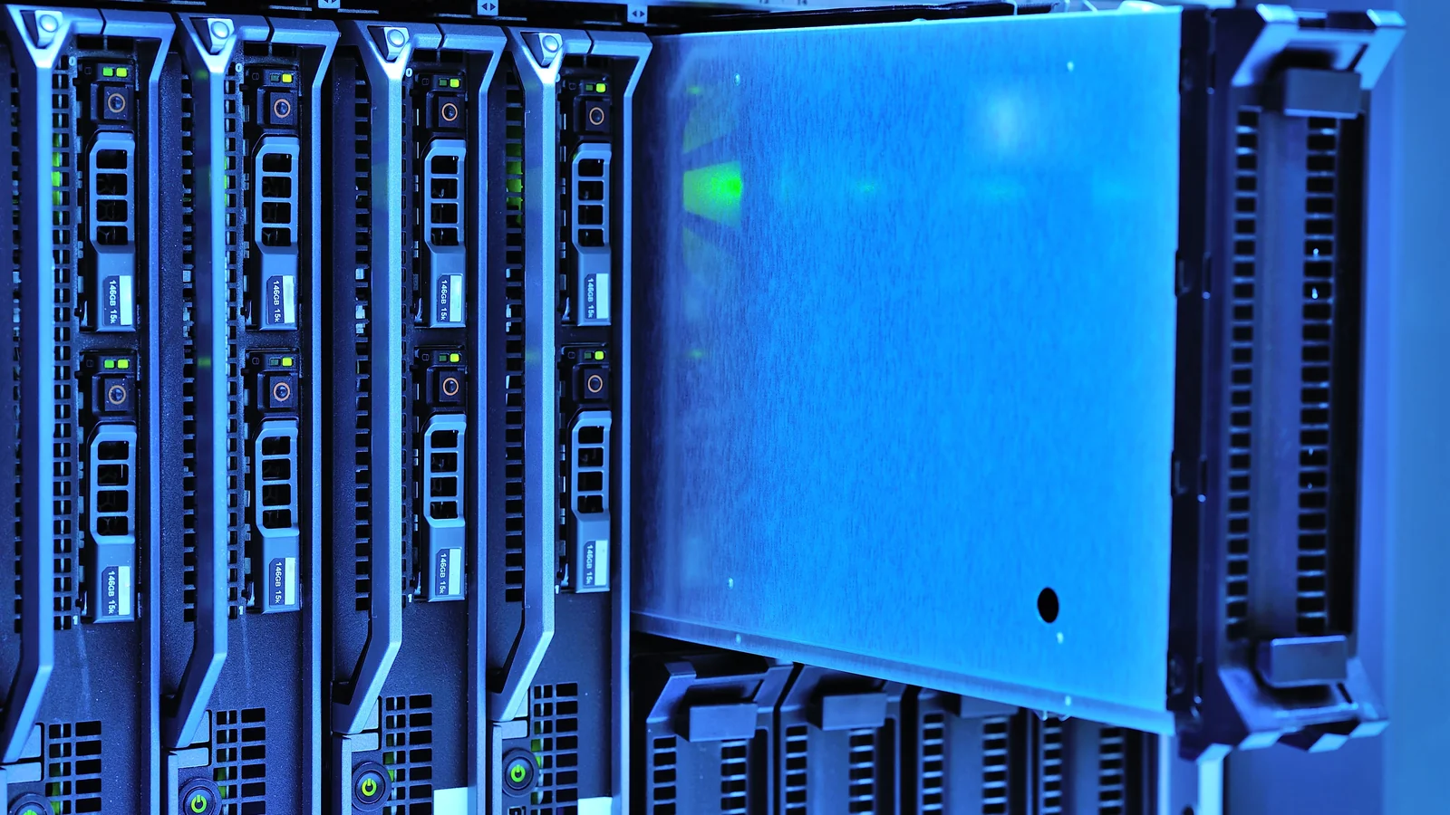 Detailed view of server racks with glowing lights in a data center environment.