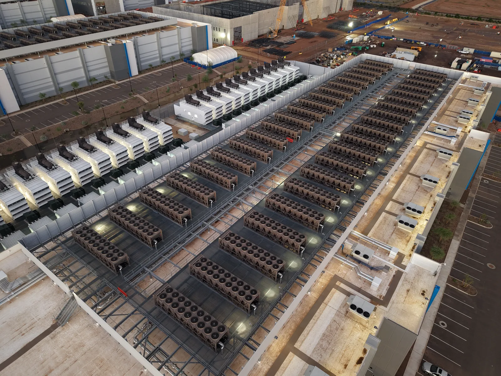 Cooling towers and backup generators on the roof of a large data center.